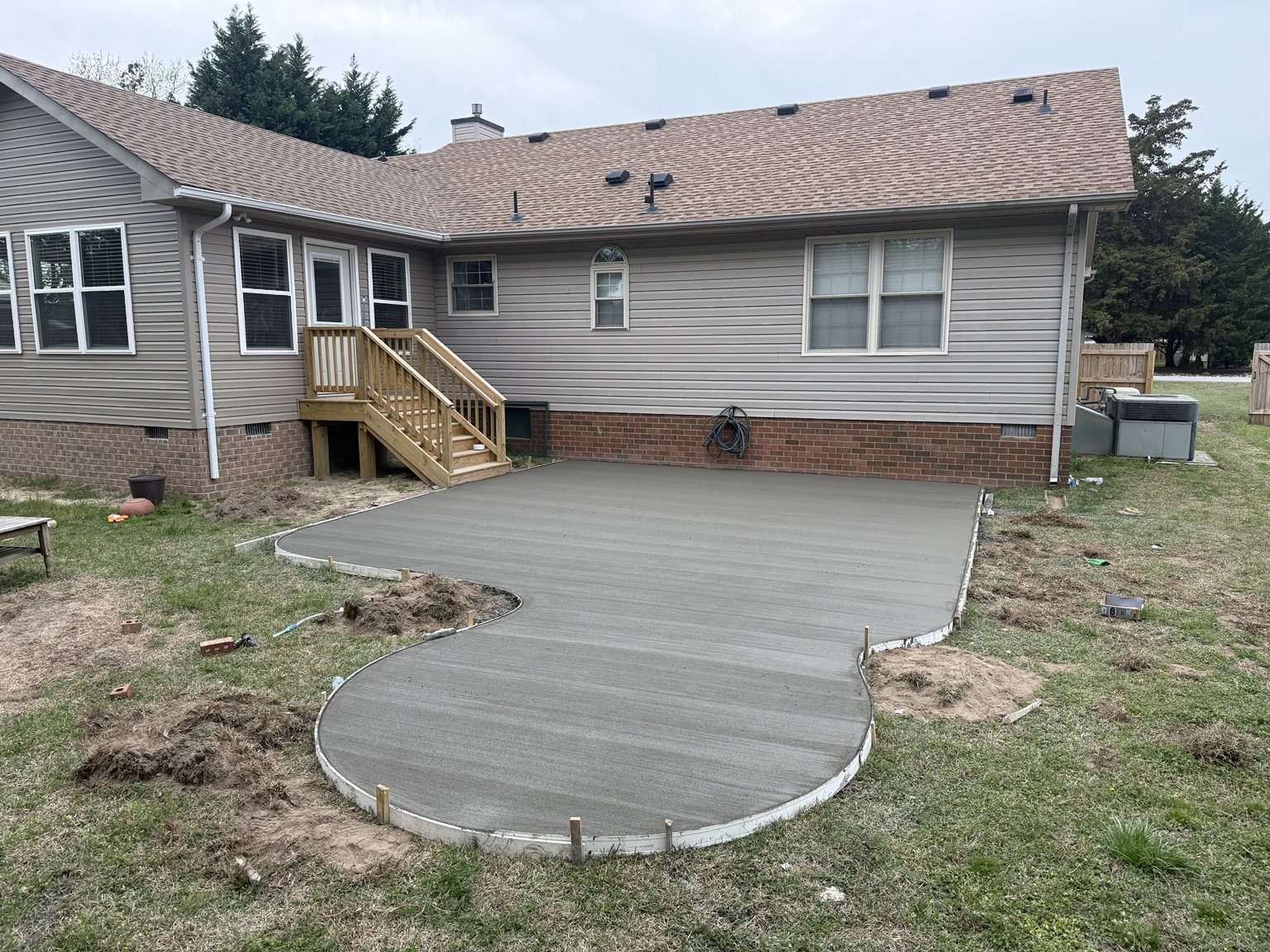 Concrete patio with curved walkway